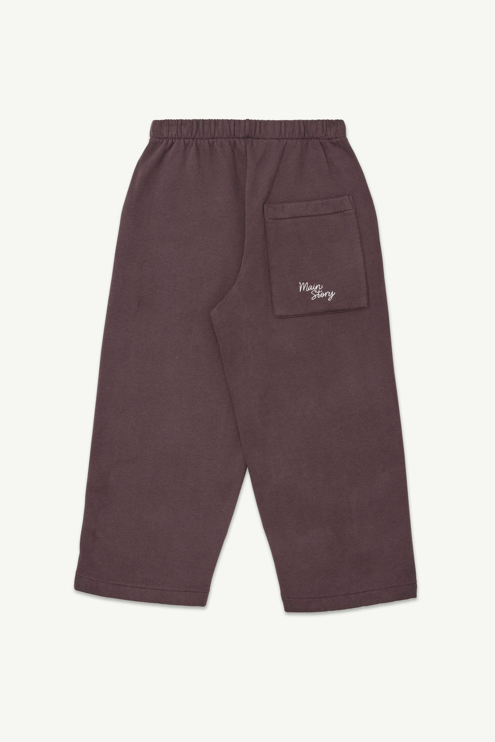 A pair of dark cherry-colored lounge pants with an elastic waistband and a small white embroidered logo on the back pocket.