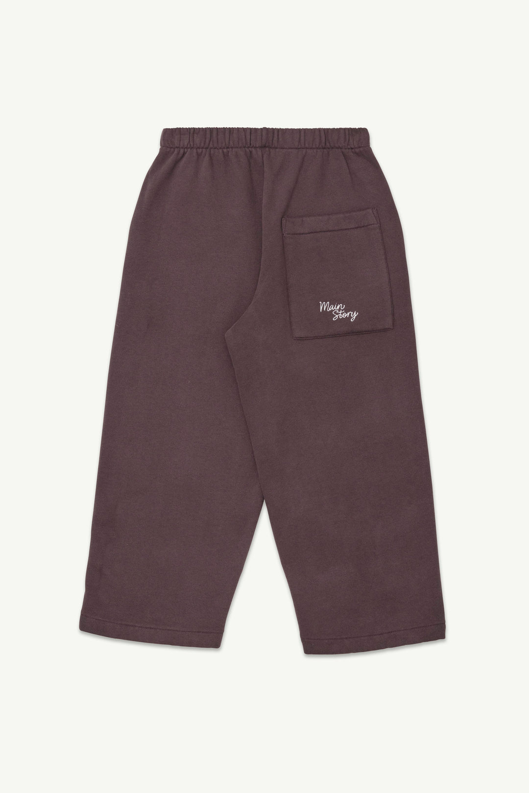 A pair of dark cherry-colored lounge pants with an elastic waistband and a small white embroidered logo on the back pocket.