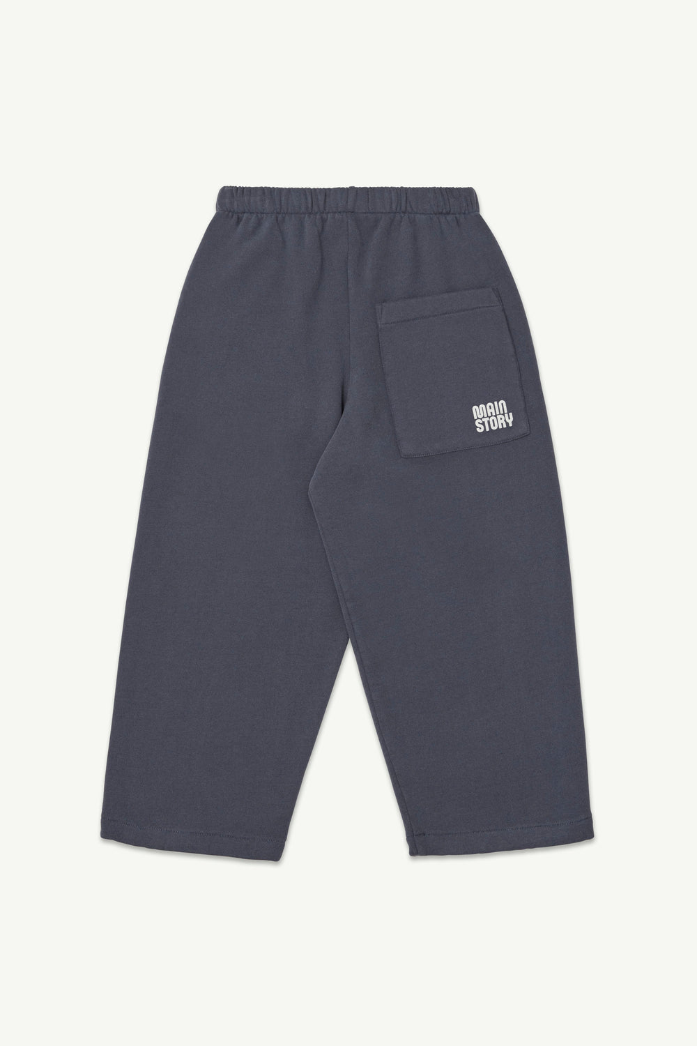 Back view of graphite blue lounge pant with an elastic waistband, and a small white logo on the back pocket.
