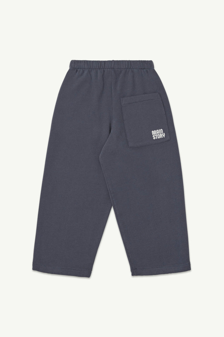 Back view of graphite blue lounge pant with an elastic waistband, and a small white logo on the back pocket.