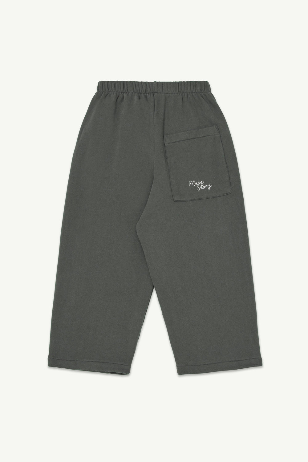 Back view of lounge pants, with an elastic waistband, and a small white embroidered logo on the pocket.