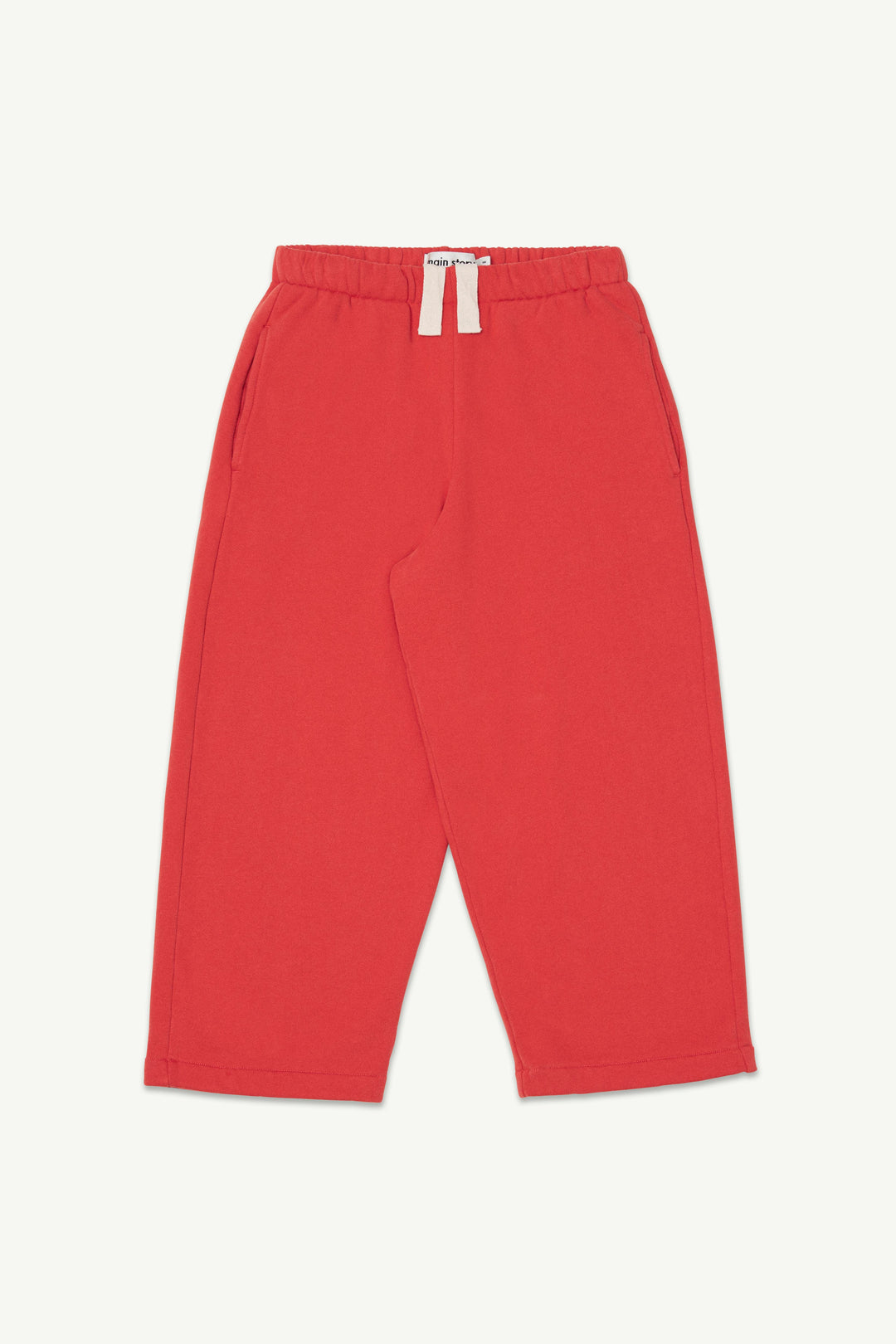 Red lounge pants with an elastic waistband and off-white drawstring.