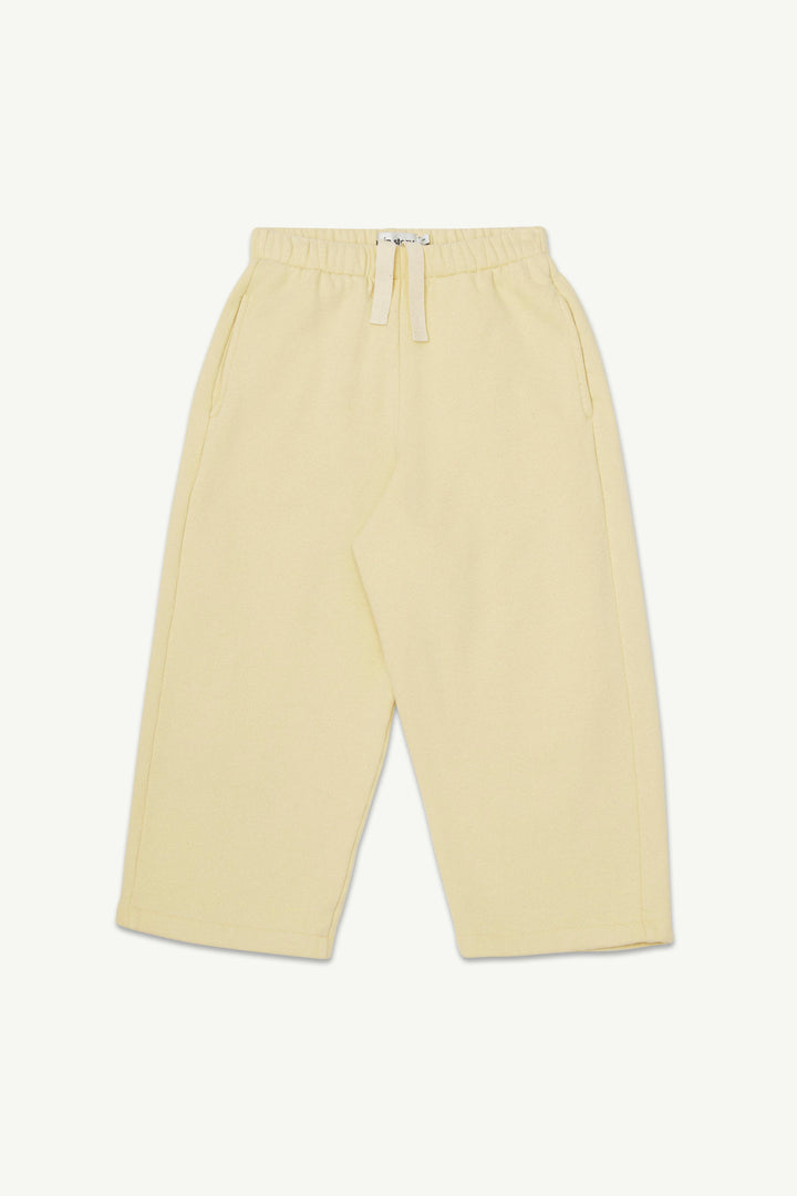 A pair of pale yellow lounge pants with an elastic waistband and drawstring.